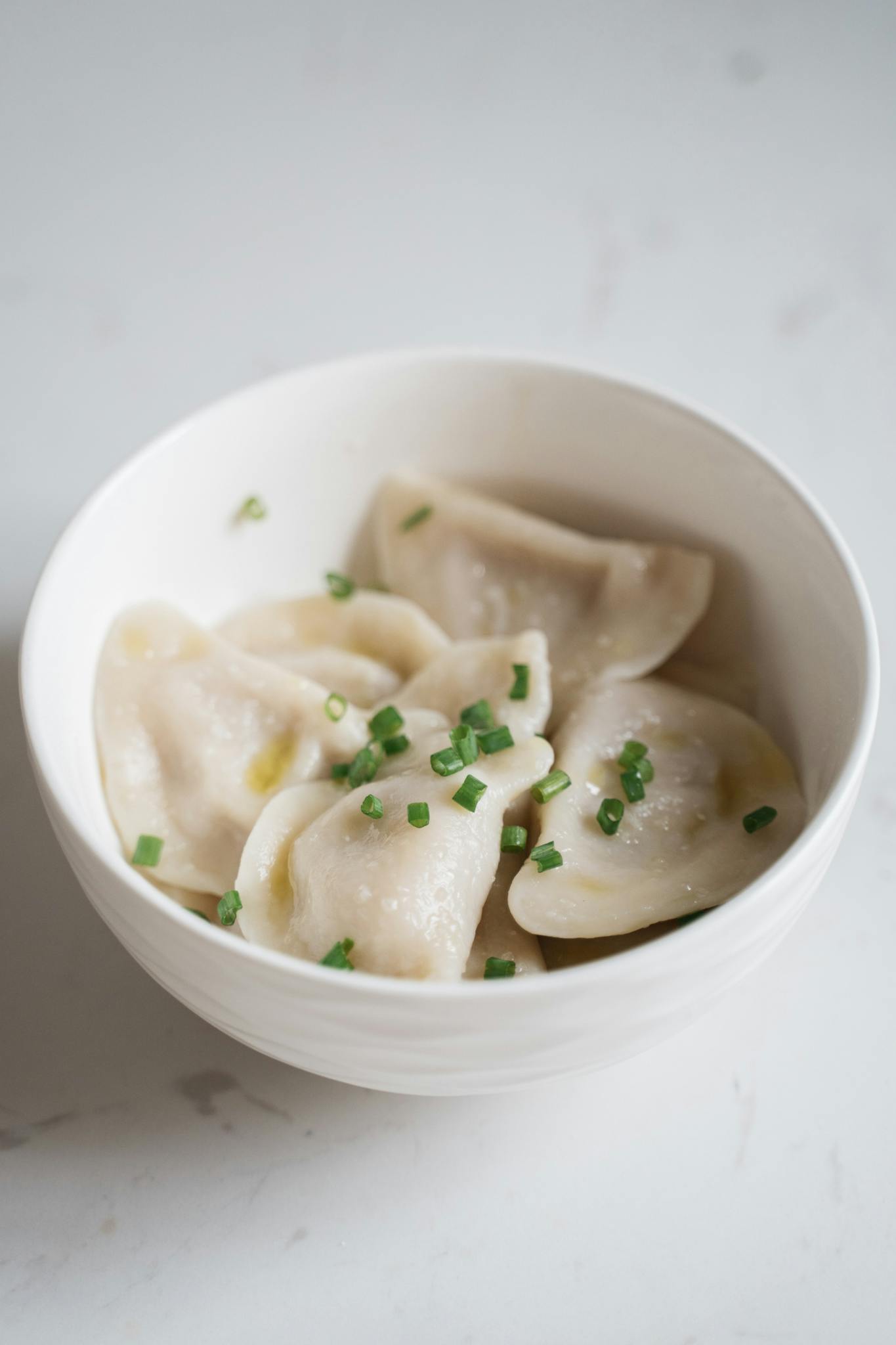 Close-Up Shot of Raw Dumplings in a Bowl